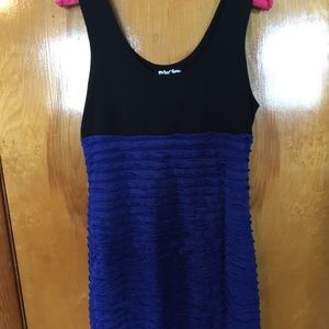 Never worn body con dress with ruffle detail.